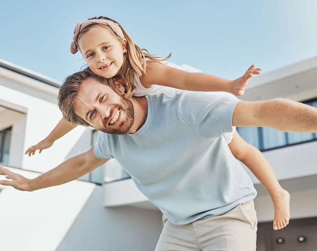 Parent and child celebrating financial progress