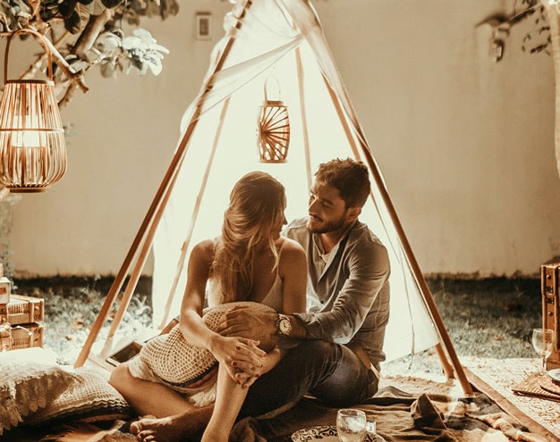 Couple relaxing outdoors after a home project