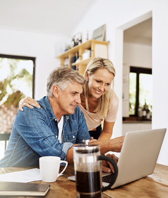 Couple reviewing loan options at home