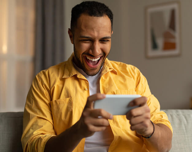 Client smiling while reviewing options on a phone